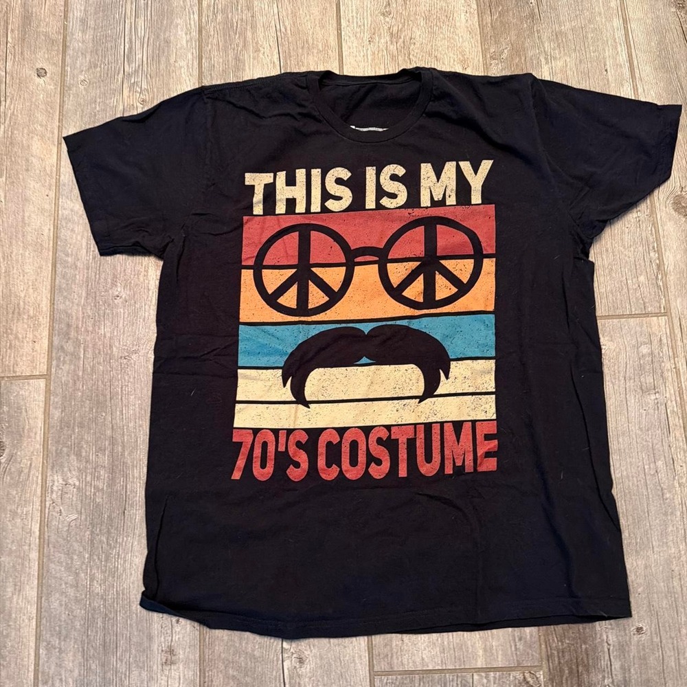 Black vintage 70s costume tee with graphic of peace sign glasses and mustache